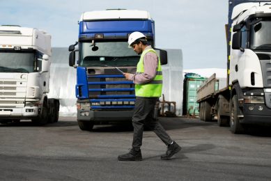 man walking on the loading bay of a TIR