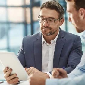 men-with-tablet-at-a-meeting